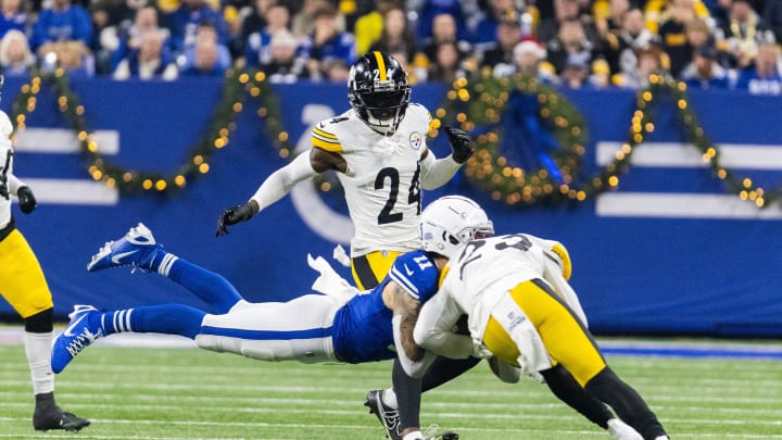 Dec 16, 2023; Indianapolis, Indiana, USA; Indianapolis Colts wide receiver Michael Pittman Jr. (11) dives for a catch while Pittsburgh Steelers safety Damontae Kazee (23) defends in the first half at Lucas Oil Stadium. Mandatory Credit: Trevor Ruszkowski-USA TODAY Sports