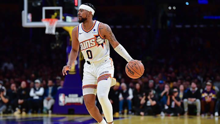 Dec 5, 2023; Los Angeles, California, USA; Phoenix Suns guard Jordan Goodwin (0) controls the ball against the Los Angeles Lakers during the second half of the In Season Tournament quarterfinal at Crypto.com Arena. Mandatory Credit: Gary A. Vasquez-Imagn Images