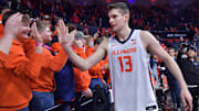 Feb 2, 2025; Champaign, Illinois, USA; Illinois Fighting Illini center Tomislav Ivisic (13) gets a hand from fans after an 87-79 win over the Ohio State Buckeyes at State Farm Center. Mandatory Credit: Ron Johnson-Imagn Images