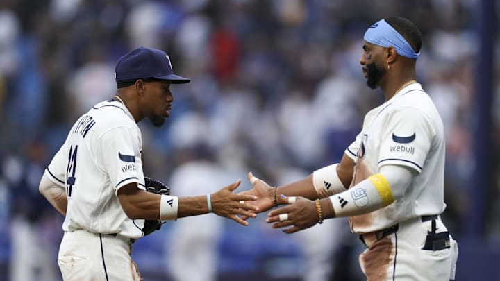 Apr 6, 2026; St. Petersburg, Florida, USA; Tampa Bay Rays center fielder Chandler Simpson (14) and designated hitter Yandy Diaz (2) react after beating the Chicago Cubs at Tropicana Field. Mandatory Credit: Nathan Ray Seebeck-Imagn Images
