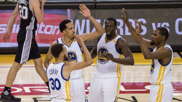 Warriors guard Stephen Curry, guard Shaun Livingston, forward Draymond Green, and forward Kevin Durant 