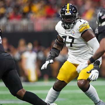 Sep 8, 2024; Atlanta, Georgia, USA; Pittsburgh Steelers offensive tackle Broderick Jones (77) blocks against the Atlanta Falcons in the fourth quarter at Mercedes-Benz Stadium. Mandatory Credit: Brett Davis-Imagn Images