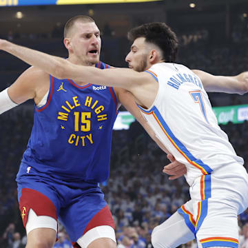  Denver Nuggets center Nikola Jokic (15) is defended by Oklahoma City Thunder forward Chet Holmgren (7) on a drive during the first quarter of game five of the second round for the 2025 NBA Playoffs at Paycom Center. Mandatory Credit: Alonzo Adams-Imagn Images