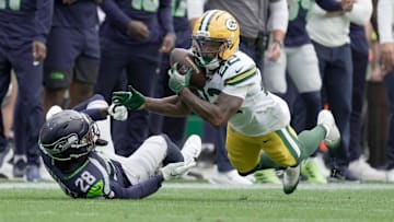 Green Bay Packers wide receiver Matthew Golden (22) makes a 39-yard reception while being covered by Seattle Seahawks cornerback Nehemiah Pritchett (28) during the first quarter of their preseason game Saturday, August 23, 2025 at Lambeau Field in Green Bay, Wisconsin.