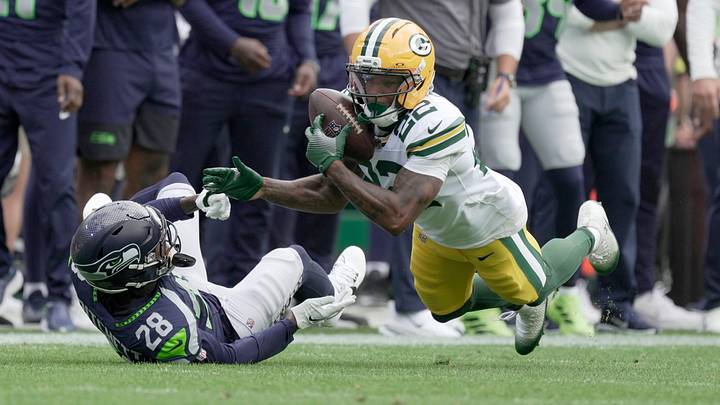 Green Bay Packers wide receiver Matthew Golden (22) makes a 39-yard reception while being covered by Seattle Seahawks cornerback Nehemiah Pritchett (28) during the first quarter of their preseason game Saturday, August 23, 2025 at Lambeau Field in Green Bay, Wisconsin.