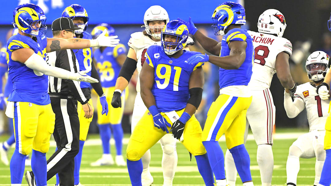 Dec 28, 2024; Inglewood, California, USA;  Los Angeles Rams defensive tackle Kobie Turner (91) celebrates after sacking Arizona Cardinals quarterback Kyler Murray (1) in the second half at SoFi Stadium. Mandatory Credit: Jayne Kamin-Oncea-Imagn Images