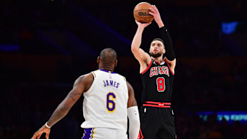 Mar 26, 2023; Los Angeles, California, USA; Chicago Bulls guard Zach LaVine (8) shoots against Los Angeles Lakers forward LeBron James (6) during the second half at Crypto.com Arena. Mandatory Credit: Gary A. Vasquez-Imagn Images