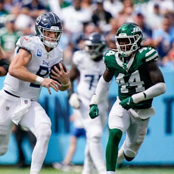 Tennessee Titans quarterback Will Levis (8) runs to bring in a first down against the New York Jets during the third quarter at Nissan Stadium in Nashville, Tenn., Sunday, Sept. 15, 2024.