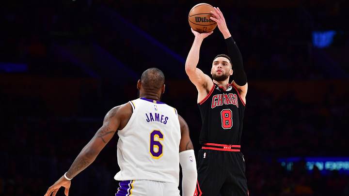 Mar 26, 2023; Los Angeles, California, USA; Chicago Bulls guard Zach LaVine (8) shoots against Los Angeles Lakers forward LeBron James (6) during the second half at Crypto.com Arena. Mandatory Credit: Gary A. Vasquez-Imagn Images