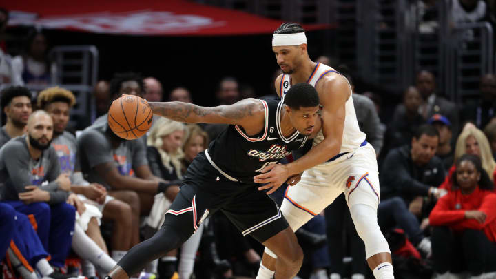 Mar 11, 2023; Los Angeles, California, USA; Los Angeles Clippers forward Paul George (13) dribbles the ball against New York Knicks guard Josh Hart (3) during the second half at Crypto.com Arena. Mandatory Credit: Kiyoshi Mio-USA TODAY Sports