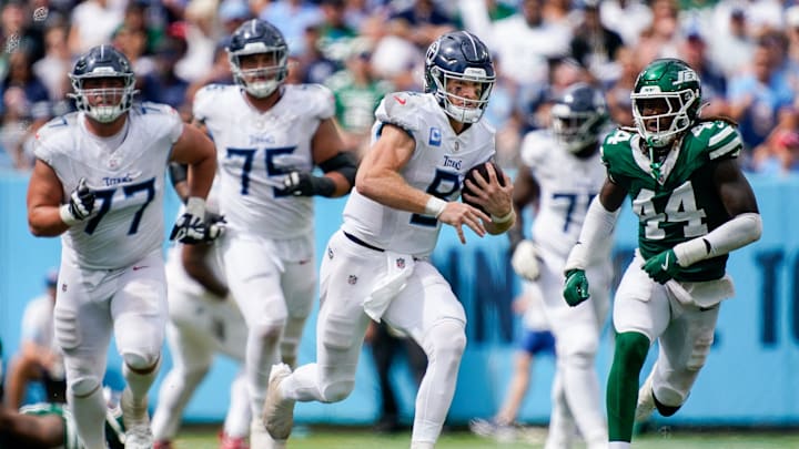 Tennessee Titans quarterback Will Levis (8) runs to bring in a first down against the New York Jets during the third quarter at Nissan Stadium in Nashville, Tenn., Sunday, Sept. 15, 2024.