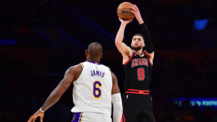 Mar 26, 2023; Los Angeles, California, USA; Chicago Bulls guard Zach LaVine (8) shoots against Los Angeles Lakers forward LeBron James (6) during the second half at Crypto.com Arena. 