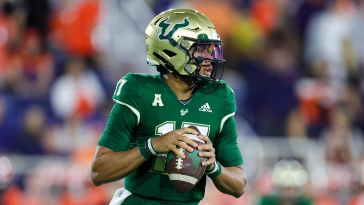 Dec 21, 2023; Boca Raton, FL, USA; South Florida Bulls quarterback Byrum Brown (17) drops back to pass against the Syracuse Orange in the first quarter during the RoofClaim.com Boca Raton Bowl at FAU Stadium. Mandatory Credit: Nathan Ray Seebeck-USA TODAY Sports