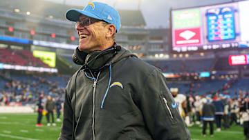 Los Angeles Chargers head coach Jim Harbaugh reacts after defeating the New England Patriots at Gillette Stadium.