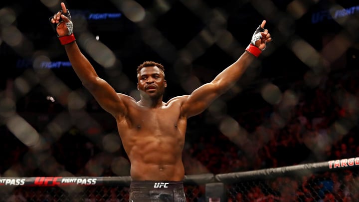 Jun 29, 2019; Minneapolis, MN, USA; Francis Ngannou (red gloves) reacts after beating Junior Dos