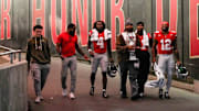 From left to right, R.J. Day, CJ Barnett, wide receiver Jeremiah Smith (4), J.T. Tuimoloau, linebacker C.J. Hicks (11) and running back CJ Donaldson Jr. (12) walk down the tunnel at halftime of the NCAA college football game at Ohio Stadium on Saturday, Nov. 15, 2025 in Columbus, Ohio.