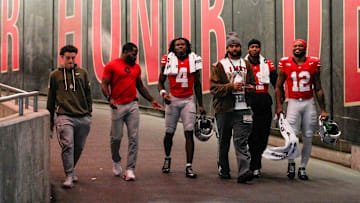 From left to right, R.J. Day, CJ Barnett, wide receiver Jeremiah Smith (4), J.T. Tuimoloau, linebacker C.J. Hicks (11) and running back CJ Donaldson Jr. (12) walk down the tunnel at halftime of the NCAA college football game at Ohio Stadium on Saturday, Nov. 15, 2025 in Columbus, Ohio.