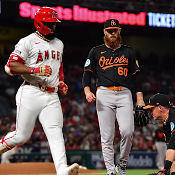 May 10, 2025; Anaheim, California, USA; Baltimore Orioles first baseman Ryan Mountcastle (6) tags first for the out against Los Angeles Angels second baseman Luis Rengifo (2) during the fifth inning at Angel Stadium. Mandatory Credit: Gary A. Vasquez-Imagn Images