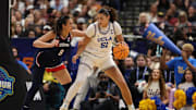 Apr 4, 2025; Tampa, FL, USA;  UCLA Bruins center Lauren Betts (51) dribbles against Connecticut Huskies center Jana El Alfy (8) during the third quarter in a semifinal of the women's 2025 NCAA tournament at Amalie Arena. Mandatory Credit: Nathan Ray Seebeck-Imagn Images