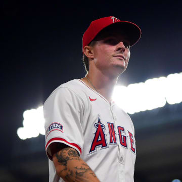 Jun 25, 2024; Anaheim, California, USA; Los Angeles Angels center fielder Mickey Moniak (16) returns to the dugout following the top of the seventh inning against the Oakland Athletics at Angel Stadium. Mandatory Credit: Gary A. Vasquez-USA TODAY Sports