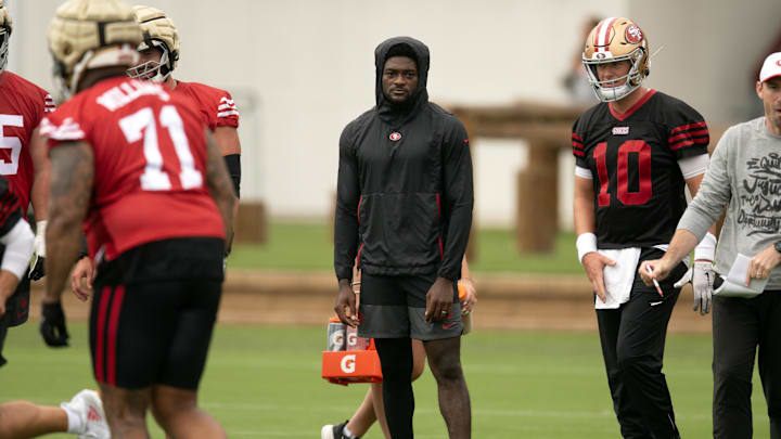 Jul 24, 2025; Santa Clara, CA, USA; San Francisco 49ers wide receiver Brandon Aiyuk (in black hoodie) watches his teammates work out during the second day of training camp. Mandatory Credit: D. Ross Cameron-Imagn Images
