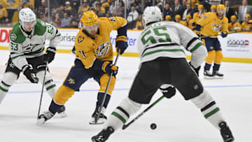Oct 26, 2025; Nashville, Tennessee, USA;  Nashville Predators center Jonathan Marchessault (81) skates with the puck as Dallas Stars defenseman Thomas Harley (55) defends during the third period at Bridgestone Arena. Mandatory Credit: Steve Roberts-Imagn Images