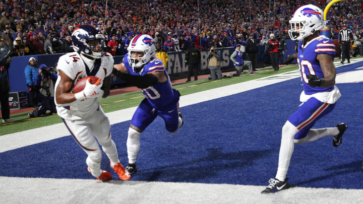 Denver Broncos wide receiver Courtland Sutton (14) manages to keep his feet inbounds for a touchdown against Buffalo Bills safety Taylor Rapp (20).