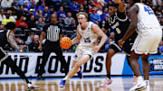 Mar 20, 2025; Denver, CO, USA; Brigham Young Cougars forward Richie Saunders (15) drives to the basket against VCU Rams guard Michael Belle (8) during the second half in the first round of the NCAA Tournament at Ball Arena. Mandatory Credit: Isaiah J. Downing-Imagn Images