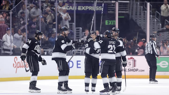 Dec 7, 2024; Los Angeles, California, USA;  Los Angeles Kings right wing Adrian Kempe (9) celebrates with teammates after scoring against the Minnesota Wild during the third period at Crypto.com Arena. Mandatory Credit: Ryan Sun-Imagn Images