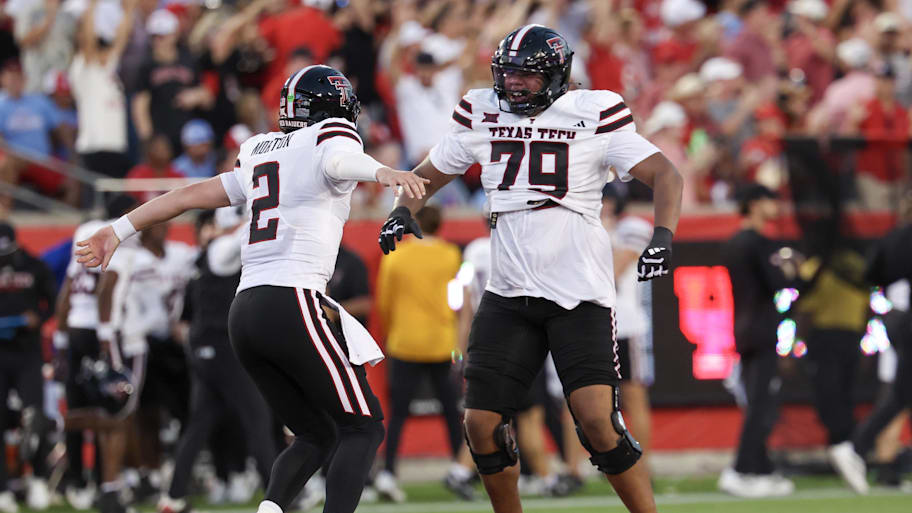 Texas Tech offensive lineman Howard Sampson celebrates with quarterback Behren Morton after a touchdown pass.