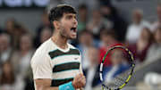Carlos Alcaraz of Spain reacts to a point during his match against Lorenzo Musetti of Italy match on day 13 at Roland Garros Stadium. 