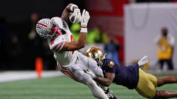 Jan 20, 2025; Atlanta, GA, USA; Ohio State Buckeyes wide receiver Emeka Egbuka (2) runs with the ball against the Notre Dame Fighting Irish during the first half the CFP National Championship college football game at Mercedes-Benz Stadium. Mandatory Credit: Brett Davis-Imagn Images