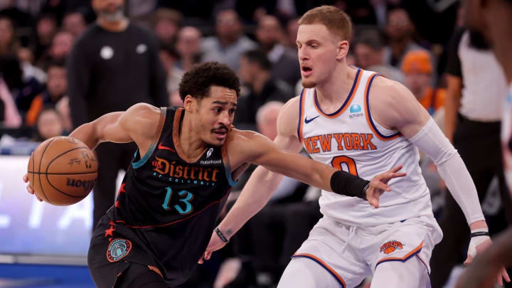 Jan 18, 2024; New York, New York, USA; Washington Wizards guard Jordan Poole (13) drives to the basket against New York Knicks guard Donte DiVincenzo (0) during the fourth quarter at Madison Square Garden. Mandatory Credit: Brad Penner-USA TODAY Sports