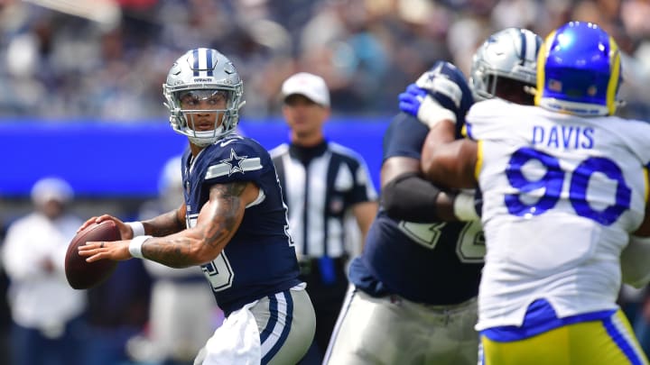 Aug 11, 2024; Inglewood, California, USA; Dallas Cowboys quarterback Trey Lance (19) throws under pressire from Los Angeles Rams defensive tackle Tyler Davis (90) during the first half at SoFi Stadium. Mandatory Credit: Gary A. Vasquez-USA TODAY Sports