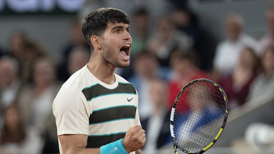 Carlos Alcaraz of Spain reacts to a point during his match against Lorenzo Musetti of Italy match on day 13 at Roland Garros Stadium.  | Susan Mullane-Imagn Images