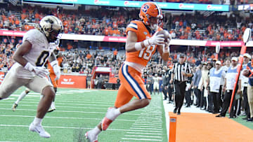 Syracuse Orange TE Oronde Gadsden II catches a winning touchdown in front of Purdue Boilermakers cornerback Bryce Hampton.