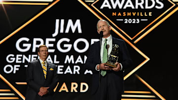 Jun 28, 2023; Nashville, Tennessee, USA; Dallas Stars general manager Jim Nill is awarded the Jim Gregory General Manager of the Year award by Nashville Predators general manager David Poile during the first round of the 2023 NHL Draft at Bridgestone Arena. Mandatory Credit: Christopher Hanewinckel-Imagn Images