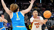 UCLA Bruins guard Kiki Rice (1) guards USC Trojans guard JuJu Watkins (12) as she passes the ball during the second half of the 2025 TIAA Big Ten Women's Basketball Tournament final game on Sunday, March 9, 2025, at Gainbridge Fieldhouse in Indianapolis. UCLA defeated USC 72-67.