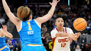 UCLA Bruins guard Kiki Rice (1) guards USC Trojans guard JuJu Watkins (12) as she passes the ball during the second half of the 2025 TIAA Big Ten Women's Basketball Tournament final game on Sunday, March 9, 2025, at Gainbridge Fieldhouse in Indianapolis. UCLA defeated USC 72-67.