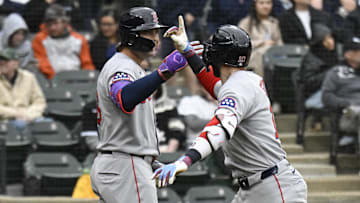 Apr 13, 2025; Chicago, Illinois, USA;  Boston Red Sox shortstop Trevor Story (10) high fives  first baseman  Triston Casas (36) after he hits a home run against the Chicago White Sox during the ninth inning at Guaranteed Rate Field. Mandatory Credit: Matt Marton-Imagn Images