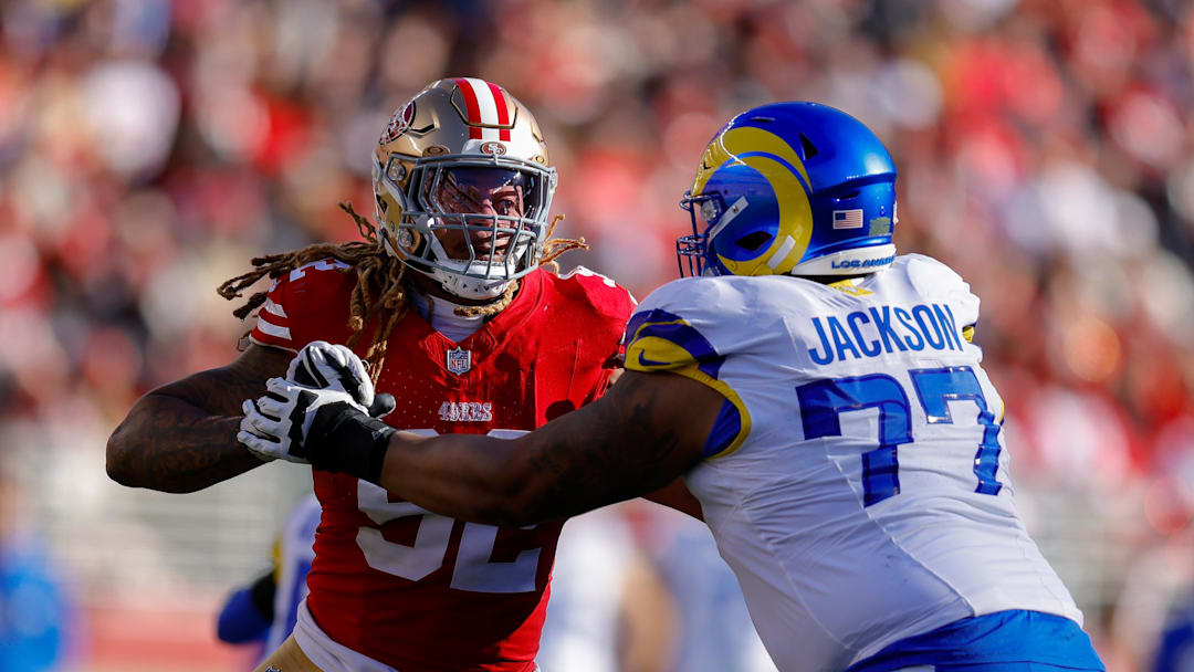 Jan 7, 2024; Santa Clara, California, USA; San Francisco 49ers defensive end Chase Young (92) rushes the passer against Los Angeles Rams offensive tackle Alaric Jackson (77) during the second quarter at Levi's Stadium. Mandatory Credit: Sergio Estrada-Imagn Images