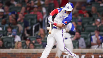 Atlanta Braves right fielder Jarred Kelenic (24) hits a single against the Minnesota Twins in the sixth inning at Truist Park in 2024.