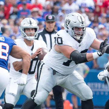 Sep 17, 2023; Orchard Park, New York, USA; Las Vegas Raiders guard Greg Van Roten (70) blocks Buffalo Bills defensive tackle DaQuan Jones (92) for quarterback Jimmy Garoppolo (10) in the second quarter at Highmark Stadium.  