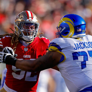 Jan 7, 2024; Santa Clara, California, USA; San Francisco 49ers defensive end Chase Young (92) rushes the passer against Los Angeles Rams offensive tackle Alaric Jackson (77) during the second quarter at Levi's Stadium. Mandatory Credit: Sergio Estrada-Imagn Images