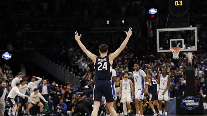 Mar 29, 2026; Washington, DC, USA; UConn Huskies guard Braylon Mullins (24) celebrates after making the game-winning three-point basket against the Duke Blue Devils in the second half during an Elite Eight game of the East Regional of the men's 2026 NCAA Tournament at Capital One Arena. Mandatory Credit: Geoff Burke-Imagn Images