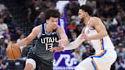 Dec 7, 2025; Salt Lake City, Utah, USA; Utah Jazz guard Walter Clayton Jr. (13) moves the ball as Oklahoma City Thunder guard Ajay Mitchell (25) defends during the second half at Delta Center.