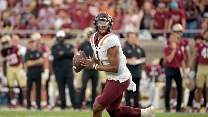 Oct 7, 2023; Tallahassee, Florida, USA; Virginia Tech Hokies quarterback Kyron Drones (1) rolls out to throw against the Florida State Seminoles during the second half at Doak S. Campbell Stadium. Mandatory Credit: Melina Myers-USA TODAY Sports