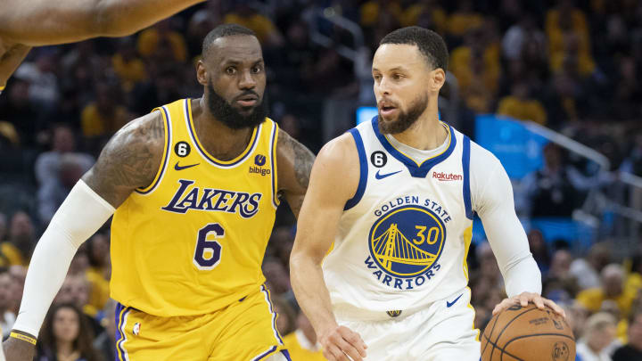 May 10, 2023; San Francisco, California, USA; Golden State Warriors guard Stephen Curry (30) dribbles the basketball against Los Angeles Lakers forward LeBron James (6) during the fourth quarter in game five of the 2023 NBA playoffs conference semifinals round at Chase Center. Mandatory Credit: Kyle Terada-USA TODAY Sports