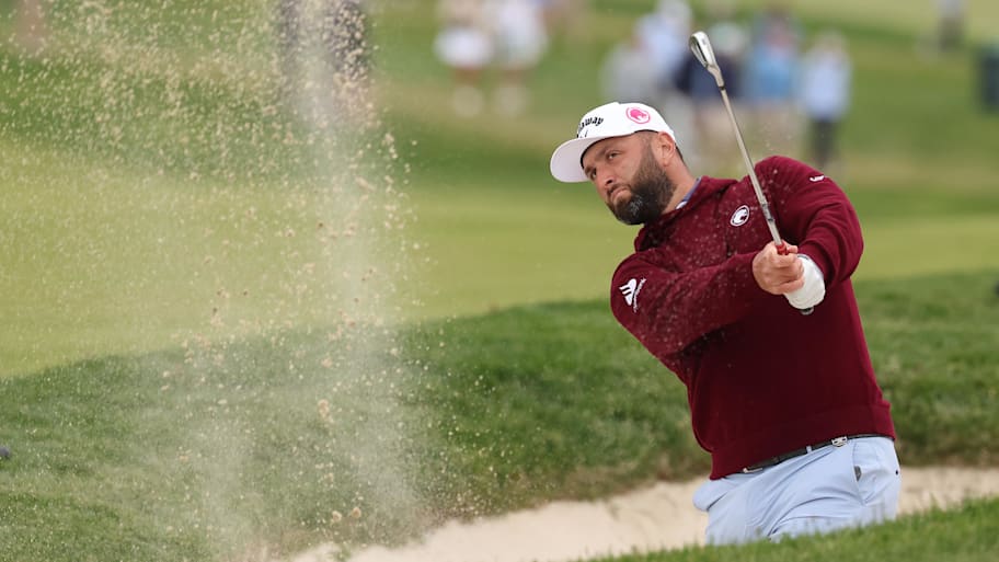 Jon Rahm hits a bunker shot on the sixth fairway during the second round of the PGA Championship.