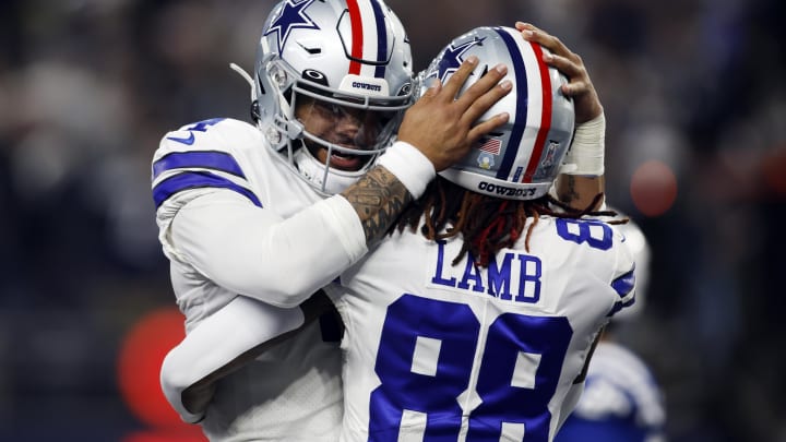 Dec 4, 2022; Arlington, Texas, USA; Dallas Cowboys wide receiver CeeDee Lamb (88) is congratulated by quarterback Dak Prescott (4) after scoring a touchdown in the first quarter against the Indianapolis Colts at AT&T Stadium. 